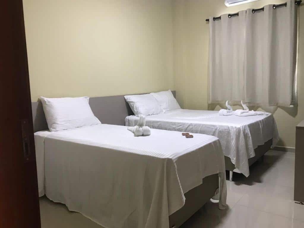 Quarto com cama na Pousada BarbacoaR .