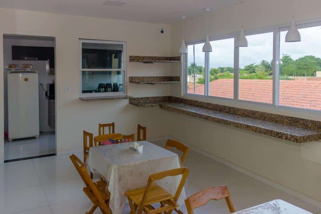 Area do café da manhã na Pousada Vila do Carmo.